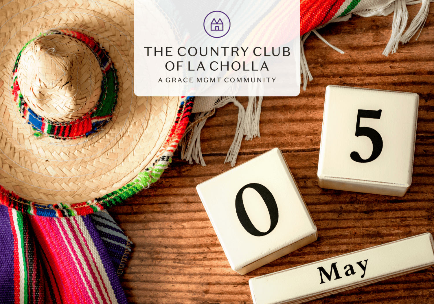 Straw sun hat with colorful woven band on a wooden table, beside calendar blocks showing '05' and 'May' and a logo reading The Country Club of La Cholla.